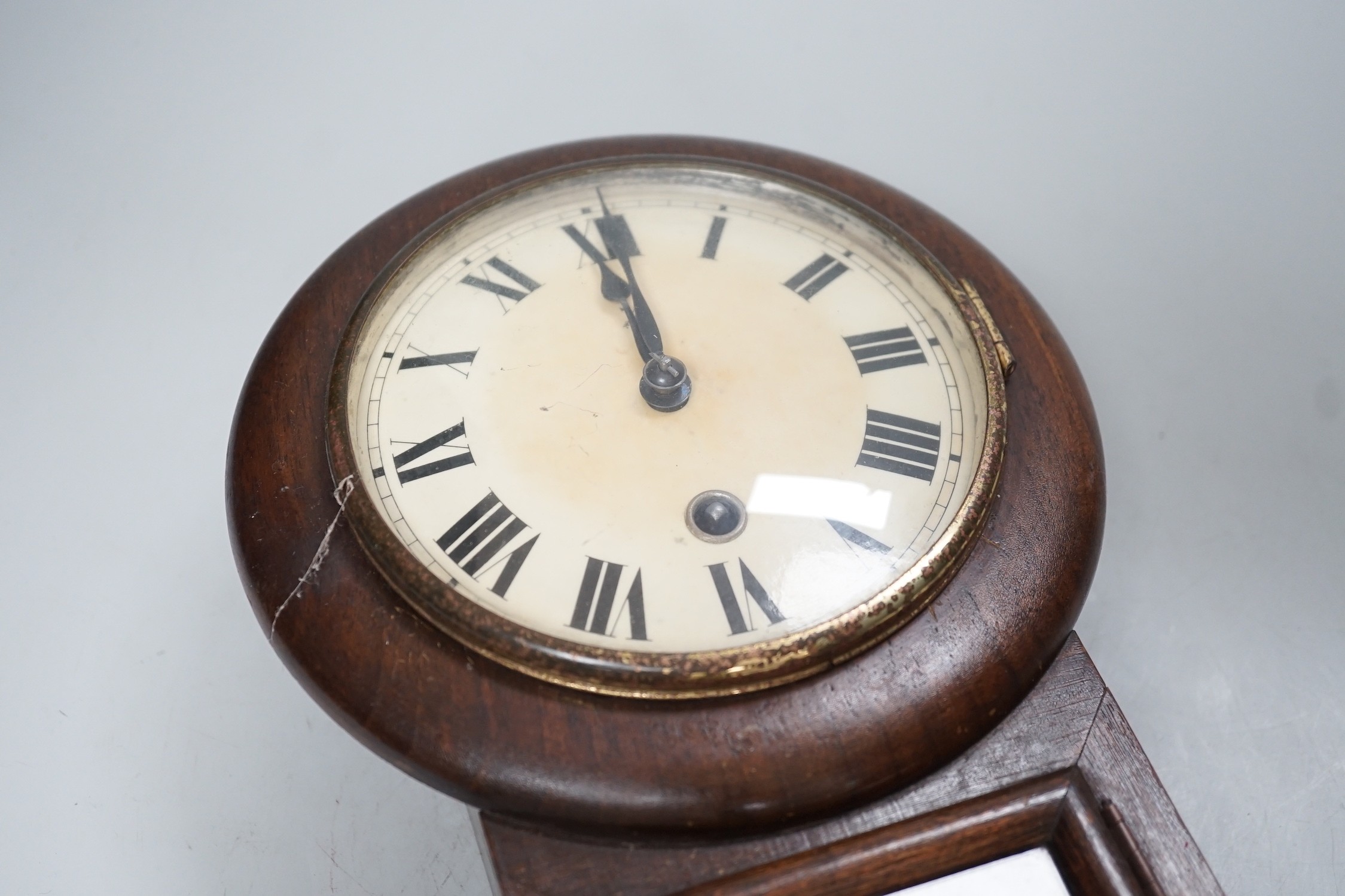 A small drop-dial wall clock, 31cm long
